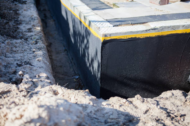 Professional Interior Drainage System technician working in Warsaw, KY